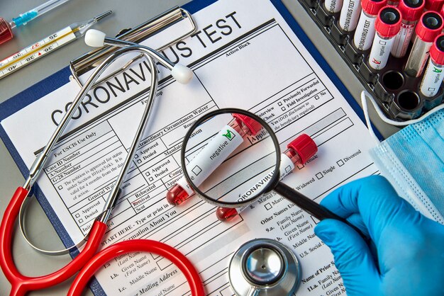 Test tubes with blood tests for COVID-19 on the test form