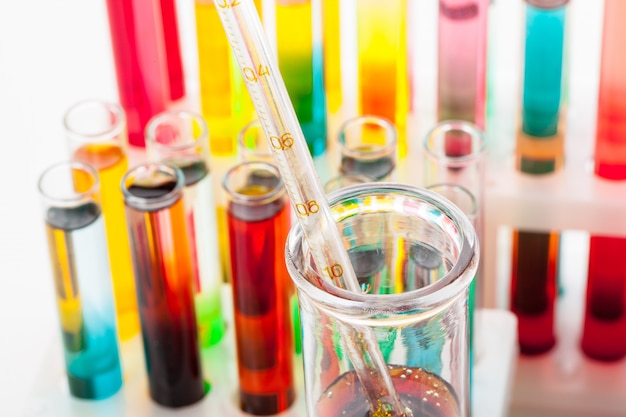 Test tubes with colorful chemicals close up in laboratory