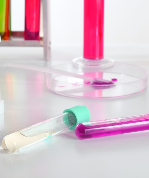 Test tubes with multicolored liquids on the table Chemists desktop