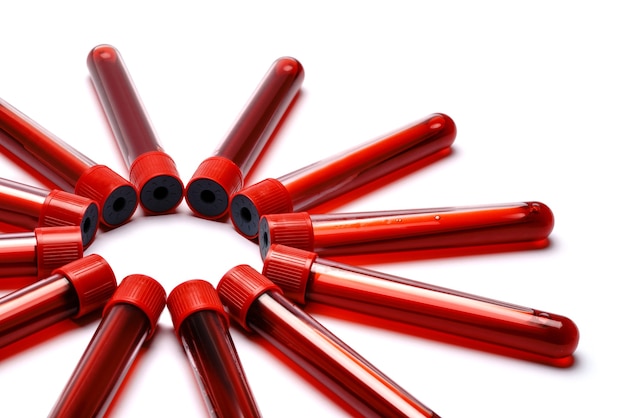 Test tubes with red plug isolated on white