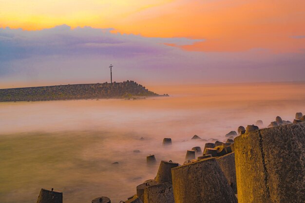 Tetrapods or breakwaters on the glagah beach kulonprogo indonesia during sunrise nature long exposure photography