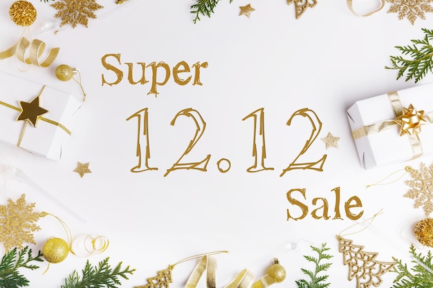 Text 12.12 super sale and golden gift boxes on white background. Flat lay promotion composition.