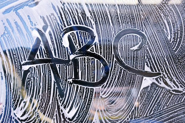 text abc on car window car wash