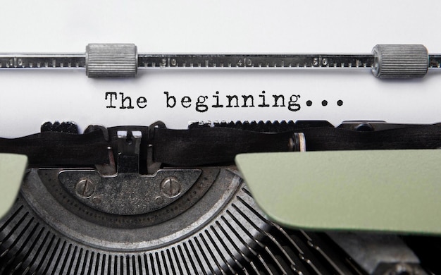 Text The beginning typed on retro typewriter