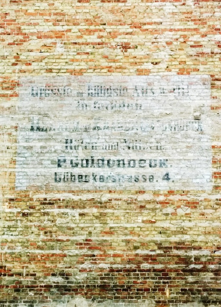 Photo text on brick wall