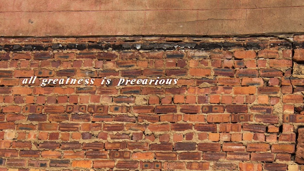 Text on brick wall