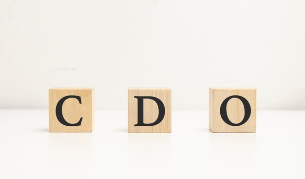 Text CDO on wooden dice standing on top of each other