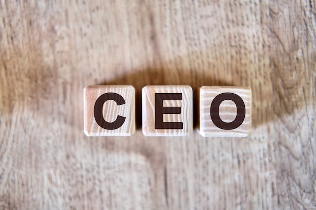 Text - CEO on wooden cubes, on wooden background