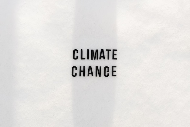 Text climate change on snowy background