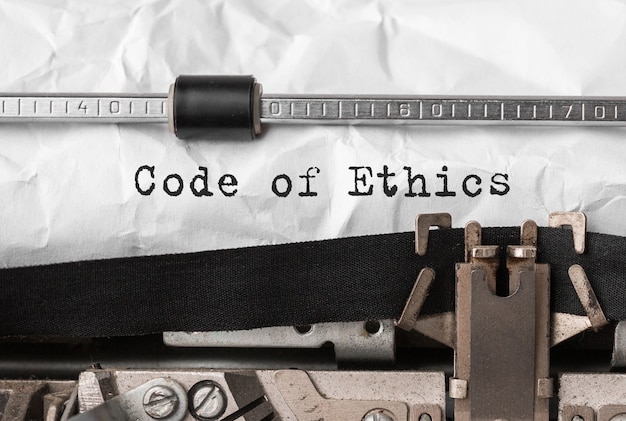 Photo text code of ethics typed on retro typewriter