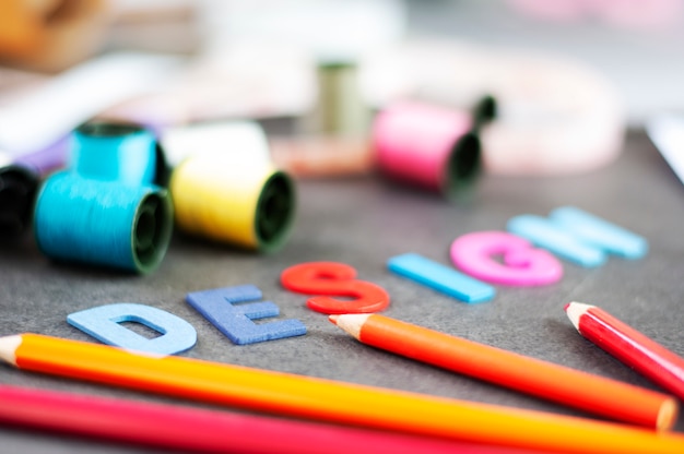 Text design on work table of Fashion designer.