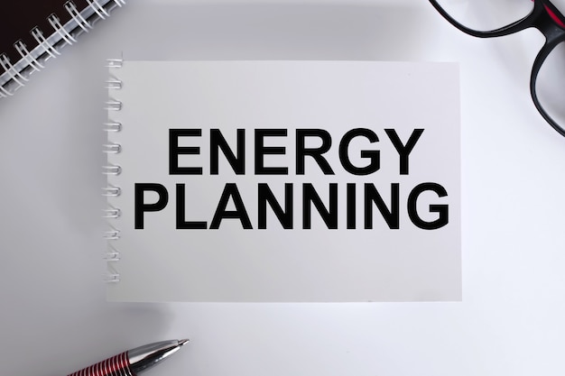 Text energy planning . Notepad with eyeglasses and text documents. Business concept