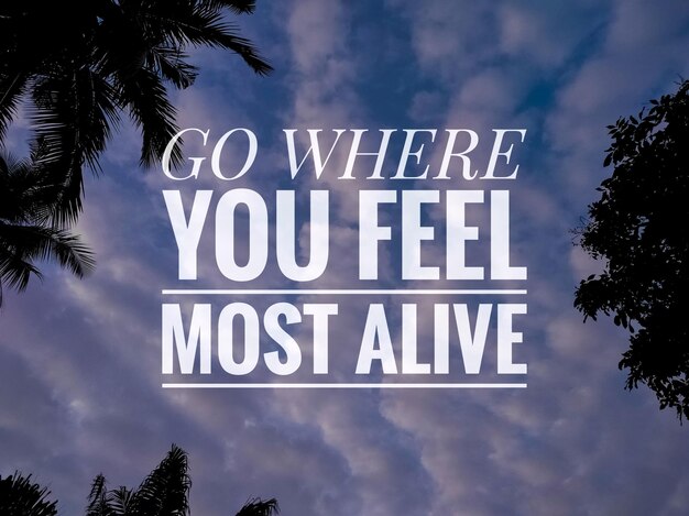 Text GO WHERE YOU FEEL MOST ALIVE with nature backgroundMotivation quote