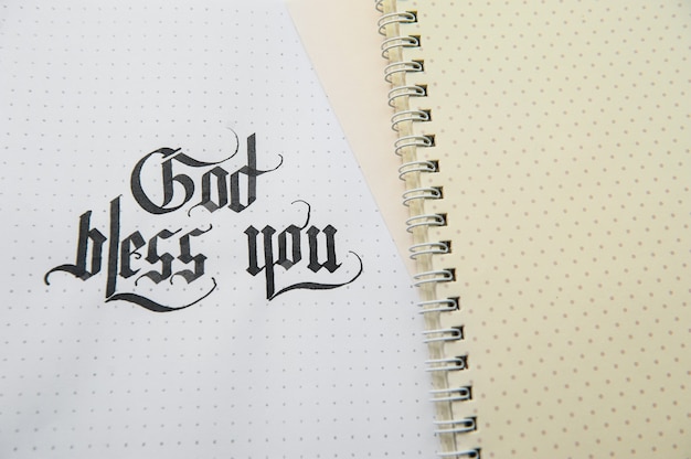 Text god bless you on the paper note texture background
