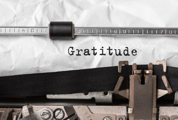 Text Gratitude typed on retro typewriter