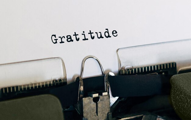 Text Gratitude typed on retro typewriter