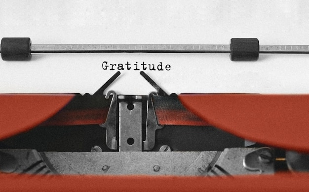 Text Gratitude typed on retro typewriter