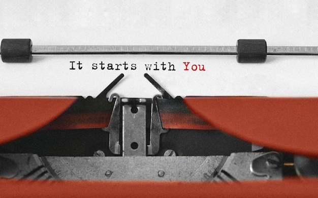 Text It starts with You typed on retro typewriter