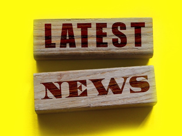 Text Latest News on a wooden blocks Mass media breaking news concept