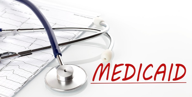 Text MEDICAID on white background with stethoscope and diagram