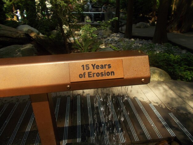 Photo text on metal railing in park