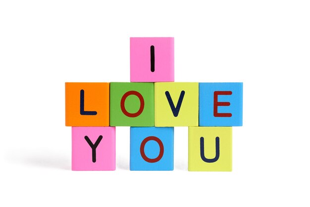 Photo text on multi colored toy blocks against white background