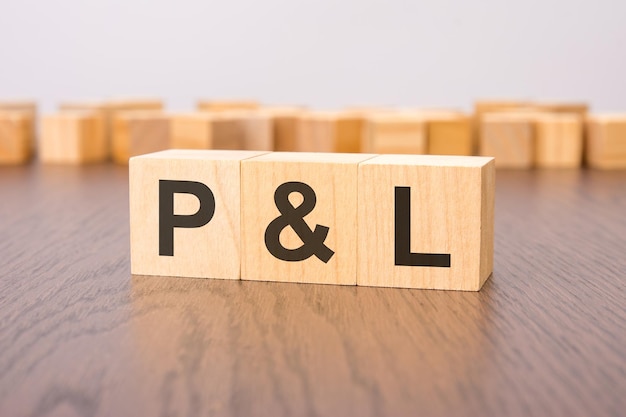 text p and l on the wooden cubes on the brown background