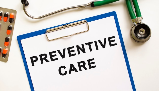 Text PREVENTIVE CARE in the folder with the stethoscope