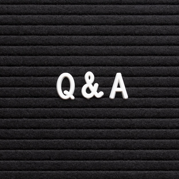 The text questions and answers on black letter board