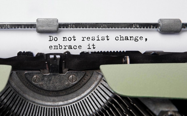 Photo text do not resist change embrace it typed on retro typewriter