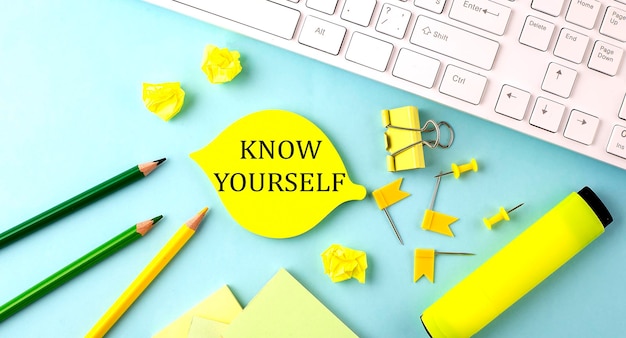 Photo text sign showing know yourself with office tools and keyboard on the blue background