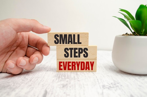 Text small steps everyday on a white background