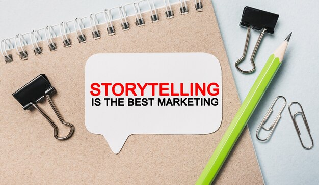 Text Storytelling is the best marketing on a white sticker with office stationery space