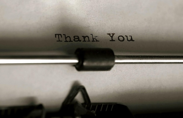 Photo text thank you typed on retro typewriter