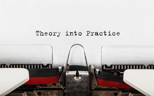 Text Theory into Practice typed on retro typewriter