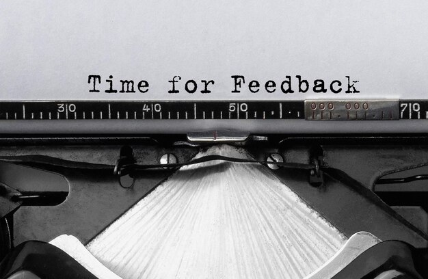 Photo text time for feedback typed on retro typewriter