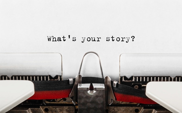 Photo text what's your story typed on retro typewriter