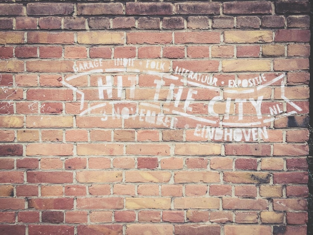 Text written on brick wall