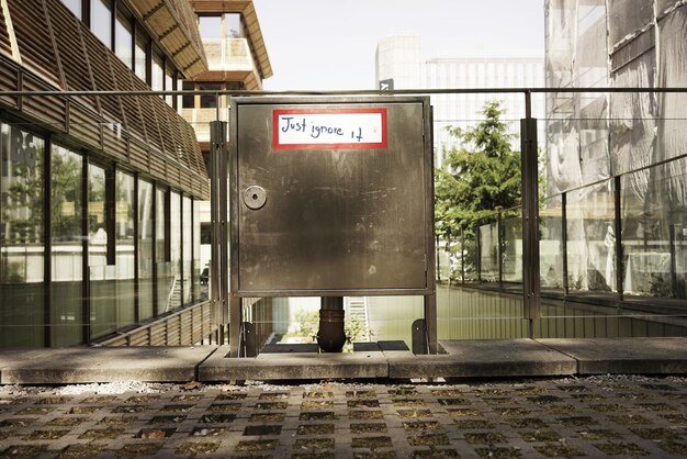 Text written on metal railing in building