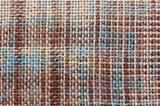 Текстильный фон, переплетение нитей крупным планом, бежево-голубой фон текстуры