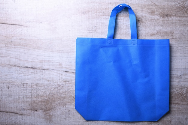 Textile bag on wooden table