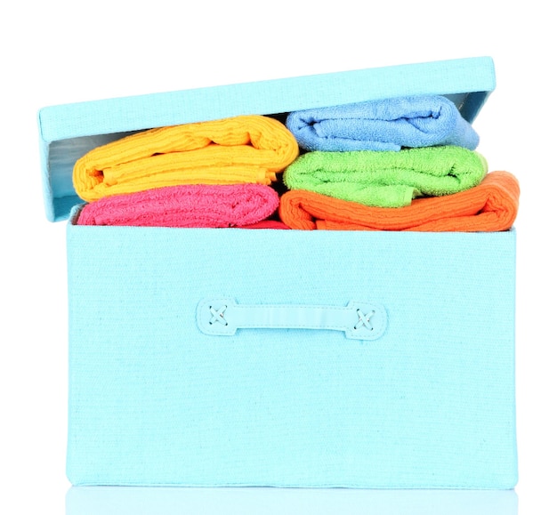 Textile box with bright towels isolated on white