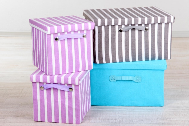 Textile boxes on floor in room