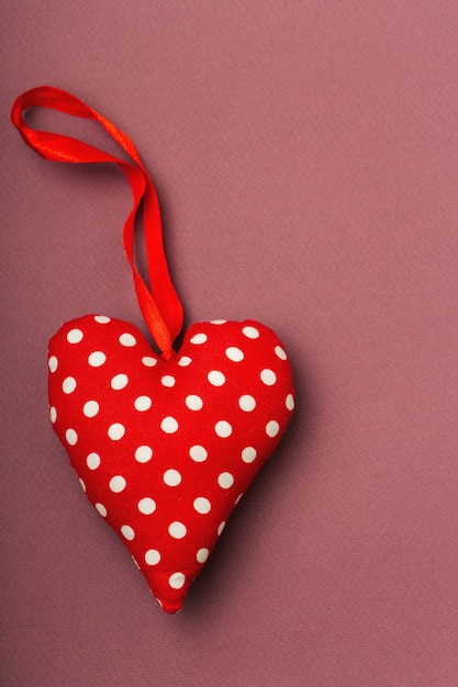 Textile heart in white polka dots, red, ribbon, Valentine, place for text, light Burgundy, love conten