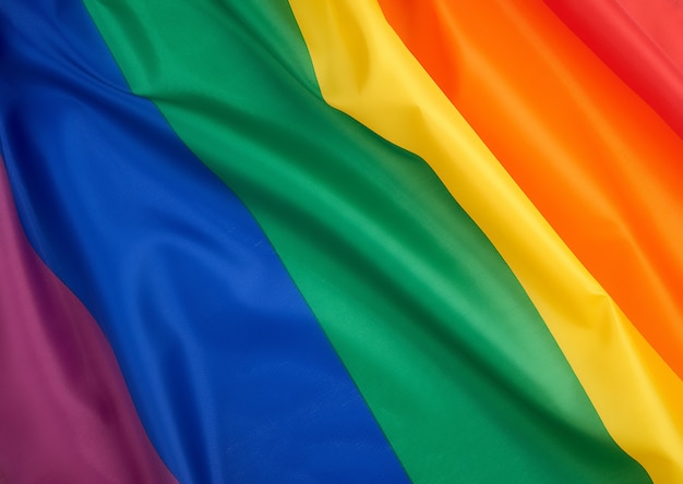 Textile rainbow flag with waves, symbol of freedom of choice of lesbians, gays, bisexuals