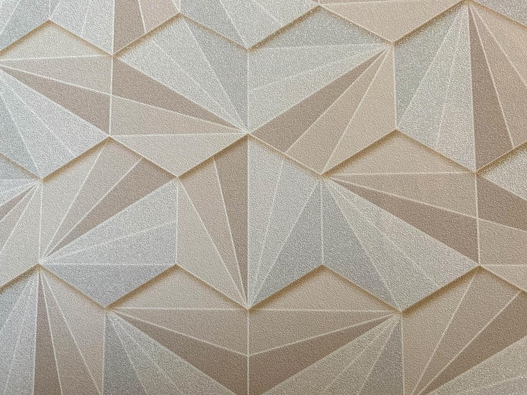 Photo texture abstract from many geometric shapes of yellow gold color hexagons the background