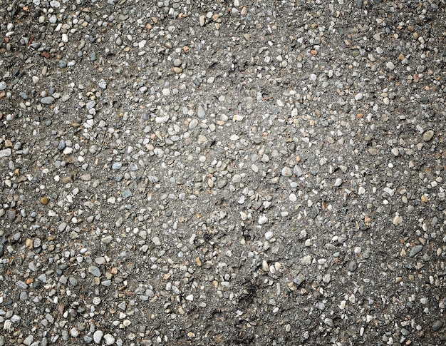 Texture of asphalt pavement with gravel for background