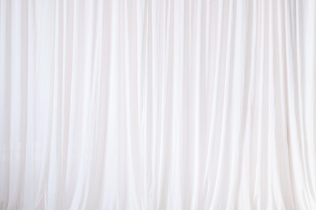 Texture of backdrop white cloth dropped down as a straight line luxury suitable for design and production of product advertising backgroundBackground for inserting text on empty spaces