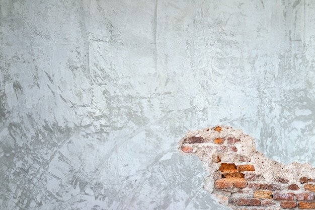 시멘트 벽과 벽에 오래 된 벽돌 균열의 질감 배경
