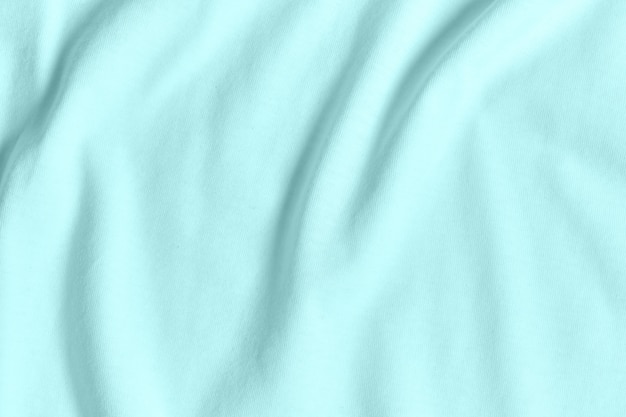 Premium Photo | Texture and background of crumpled pastel turquoise fabric